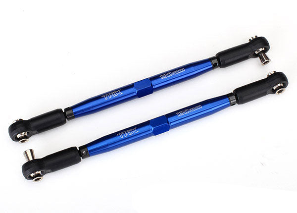 Two blue metal rods with black rod ends and metal hollow balls on a white background