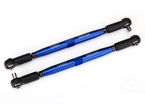 Two blue metal rods with black rod ends and metal hollow balls on a white background